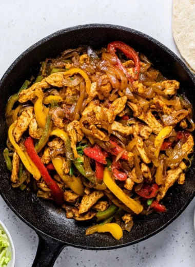 Colorful Chicken Fajitas served with tortillas and toppings