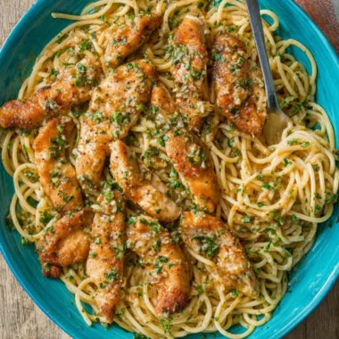 Delicious Chicken Scampi Pasta garnished with herbs and spices.