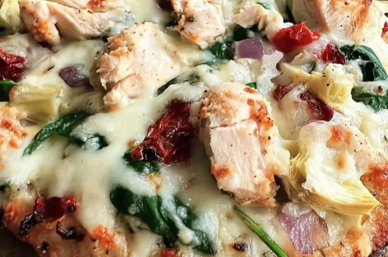 Delicious Chicken Spinach Artichoke Pizza topped with fresh ingredients.