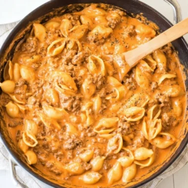 Creamy beef and shells pasta dish served on a plate