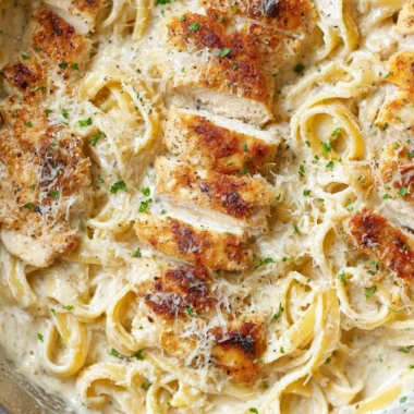 Creamy Chicken Fettuccine Alfredo served in a bowl with parsley garnish