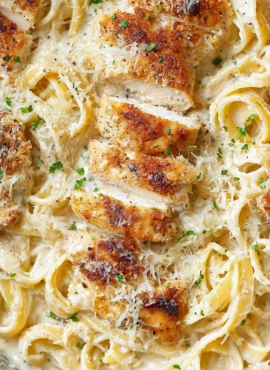 Creamy Chicken Fettuccine Alfredo served in a bowl with parsley garnish