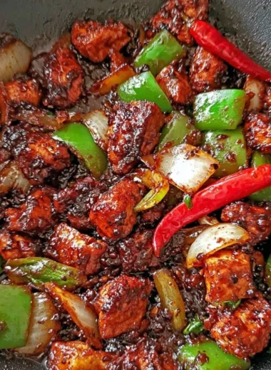 Easy Black Pepper Chicken recipe served on a plate with vegetables