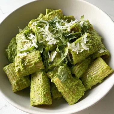 Delicious Green Goddess Pesto Pasta topped with fresh herbs and nuts