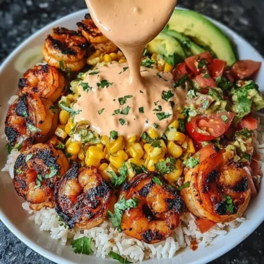 Grilled shrimp bowl with avocado, corn salsa, and creamy sauce