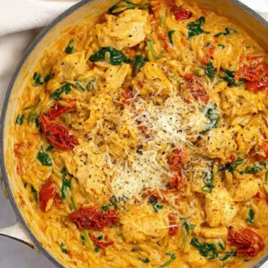 Creamy Marry Me Chicken One Pot Pasta in a dish, garnished with fresh herbs.