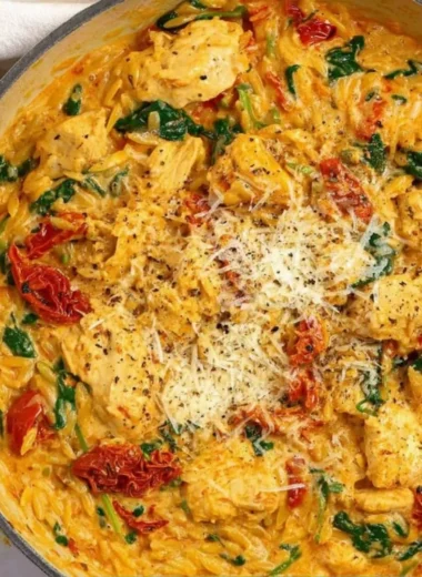 Creamy Marry Me Chicken One Pot Pasta in a dish, garnished with fresh herbs.