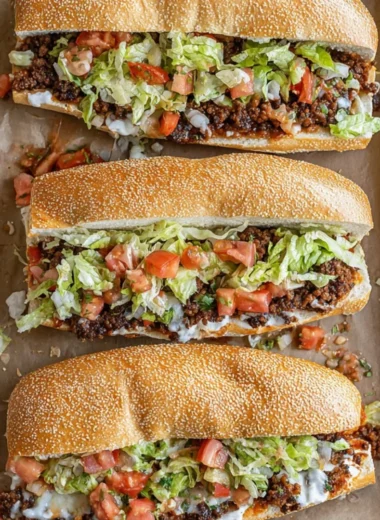 Delicious Mexican Chopped Cheese Sandwich topped with chiles and melted cheese.