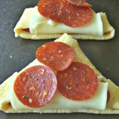 Homemade Pizza Roll-Ups with melted cheese and pepperoni in a golden crust