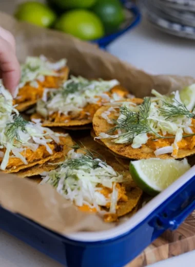 Smashed Buffalo Chicken Tacos with ranch slaw on a plate