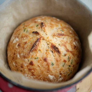 Sourdough Jalapeño Cheddar Artisan Bread loaf with melted cheese