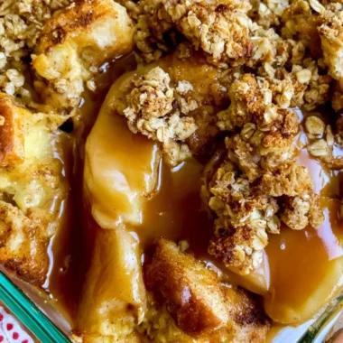 Delicious Apple Pie French Toast Casserole topped with whipped cream and cinnamon.