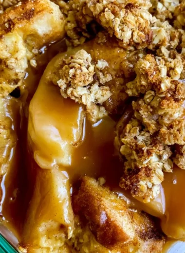 Delicious Apple Pie French Toast Casserole topped with whipped cream and cinnamon.