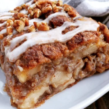 Delicious apple oat cake served on a rustic wooden table in a cozy setting