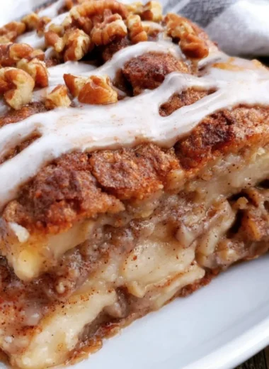 Delicious apple oat cake served on a rustic wooden table in a cozy setting