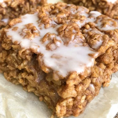 Healthy cinnamon roll baked oatmeal topped with cinnamon and nuts