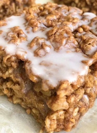 Healthy cinnamon roll baked oatmeal topped with cinnamon and nuts