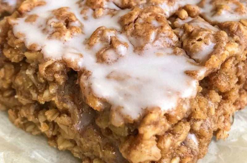 Healthy cinnamon roll baked oatmeal topped with cinnamon and nuts