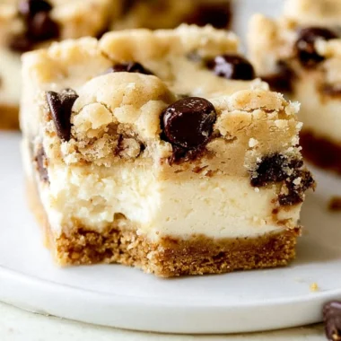 Delicious chocolate chip cheesecake bars on a plate