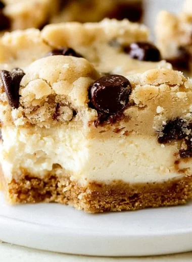 Delicious chocolate chip cheesecake bars on a plate